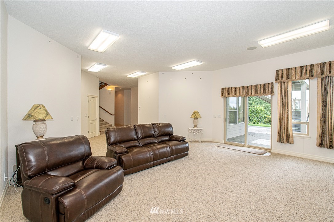 208 Brockway Road Chehalis, WA 98532 - Photo 23 of 40 a living room with furniture and a large window