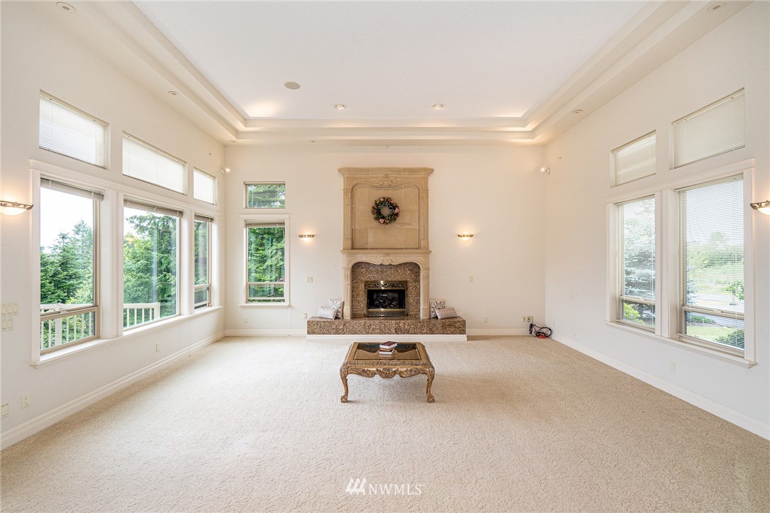 208 Brockway Road Chehalis, WA 98532 - Photo 6 of 40 a view of an empty room with a fireplace and a window