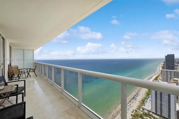 a view of balcony with furniture