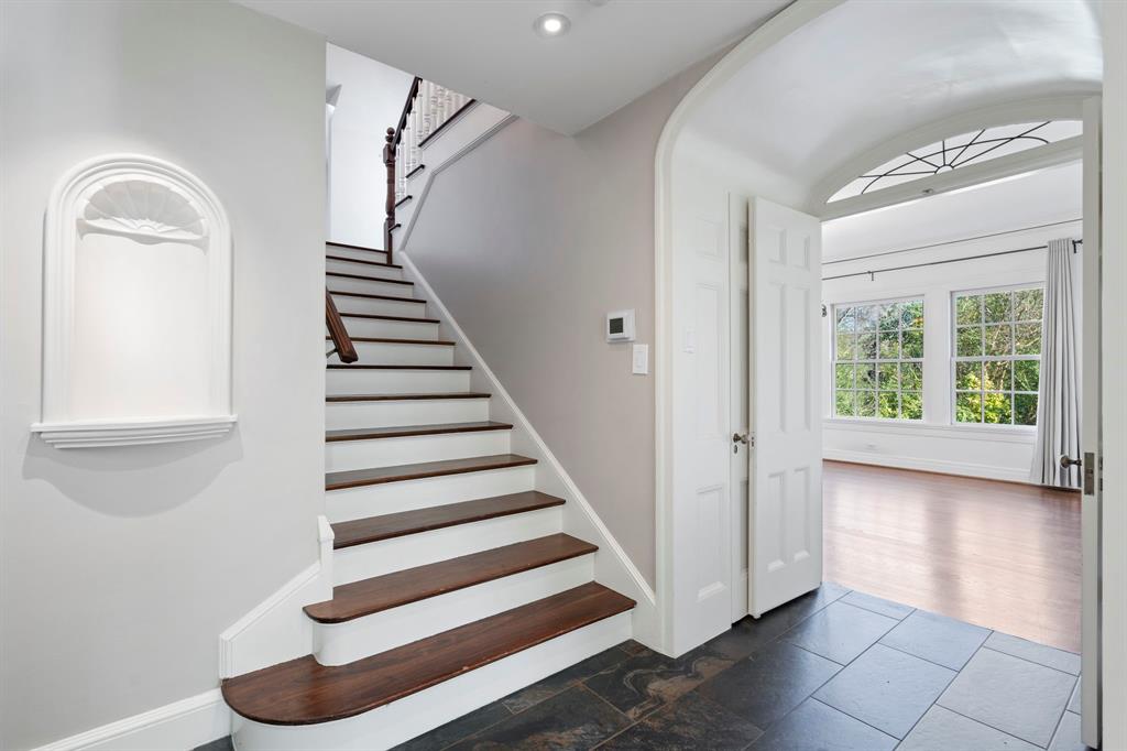 8530 Jourdan Way Dallas, TX 75225 - Photo 14 of 39 Stairs with arched walkways and baseboards