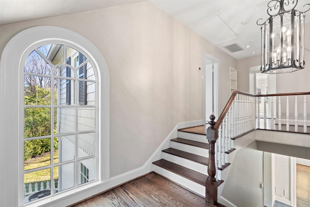8530 Jourdan Way Dallas, TX 75225 - Photo 15 of 39 Staircase featuring wood finished floors and baseboards