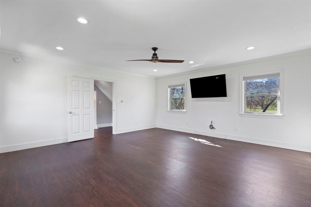 8530 Jourdan Way Dallas, TX 75225 - Photo 17 of 39 Unfurnished room featuring recessed lighting, dark wood-style floors, ceiling fan, and crown molding