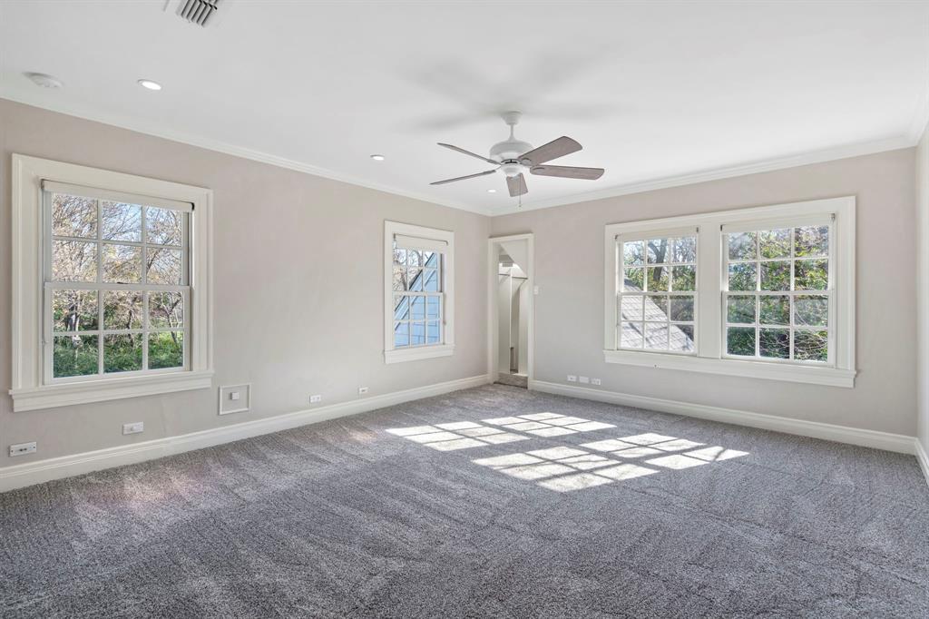 8530 Jourdan Way Dallas, TX 75225 - Photo 19 of 39 Carpeted empty room featuring crown molding, a ceiling fan, and recessed lighting