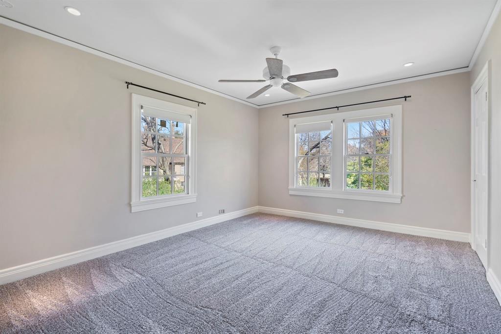 8530 Jourdan Way Dallas, TX 75225 - Photo 24 of 39 Empty room featuring light carpet, healthy amount of natural light, crown molding, a ceiling fan, and recessed lighting