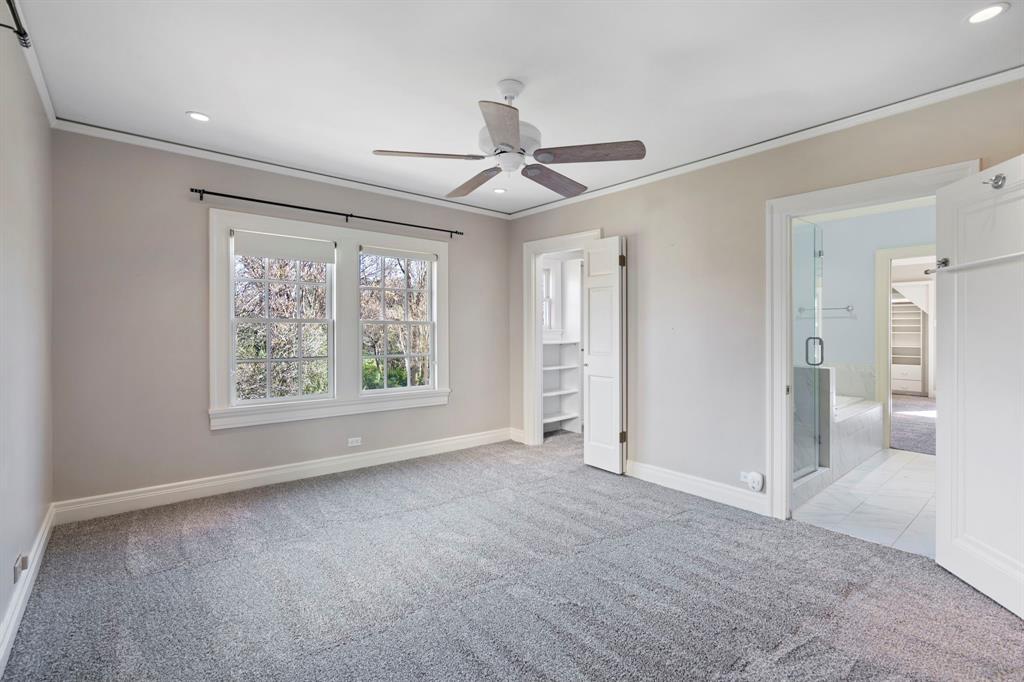 8530 Jourdan Way Dallas, TX 75225 - Photo 25 of 39 Unfurnished bedroom with light carpet, crown molding, ceiling fan, and recessed lighting
