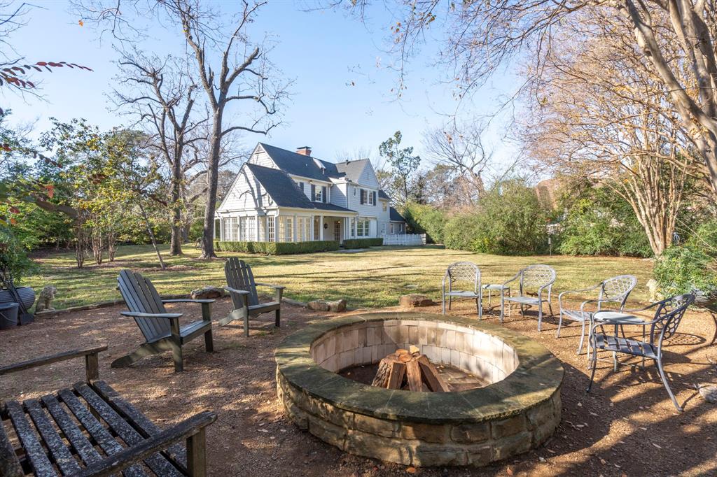 8530 Jourdan Way Dallas, TX 75225 - Photo 35 of 39 View of green lawn with a fire pit and a patio area