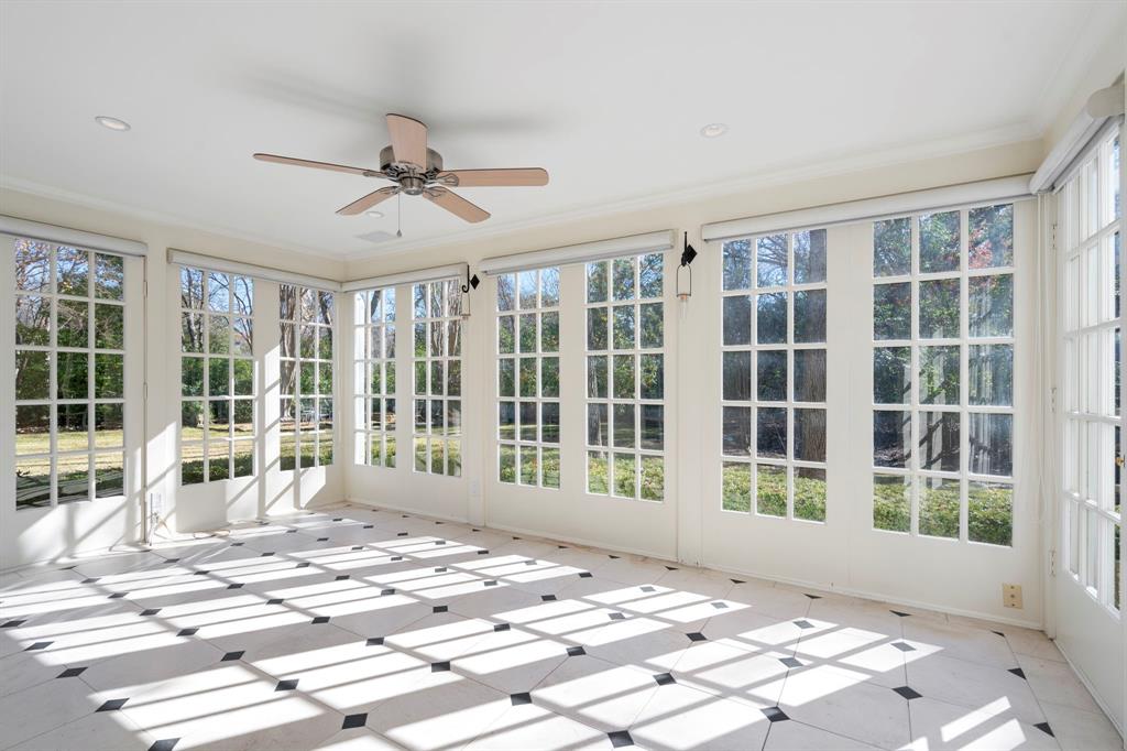 8530 Jourdan Way Dallas, TX 75225 - Photo 7 of 39 Unfurnished sunroom featuring tile patterned floors