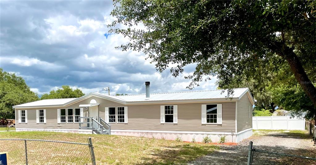 220 Diamond Acres Road Davenport, FL 33837 - Photo 1 of 1 a front view of a house with a yard