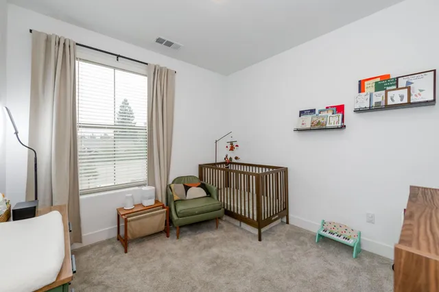 a bathroom with a toilet a sink and a mirror