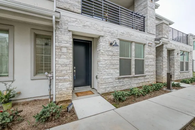 a front view of a house with brick walls