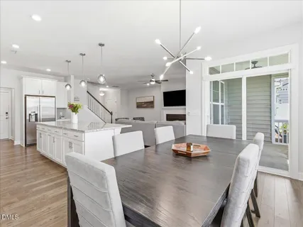 a view of a hallway with wooden floor and entryway