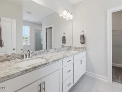 a view of a hallway with an entryway door