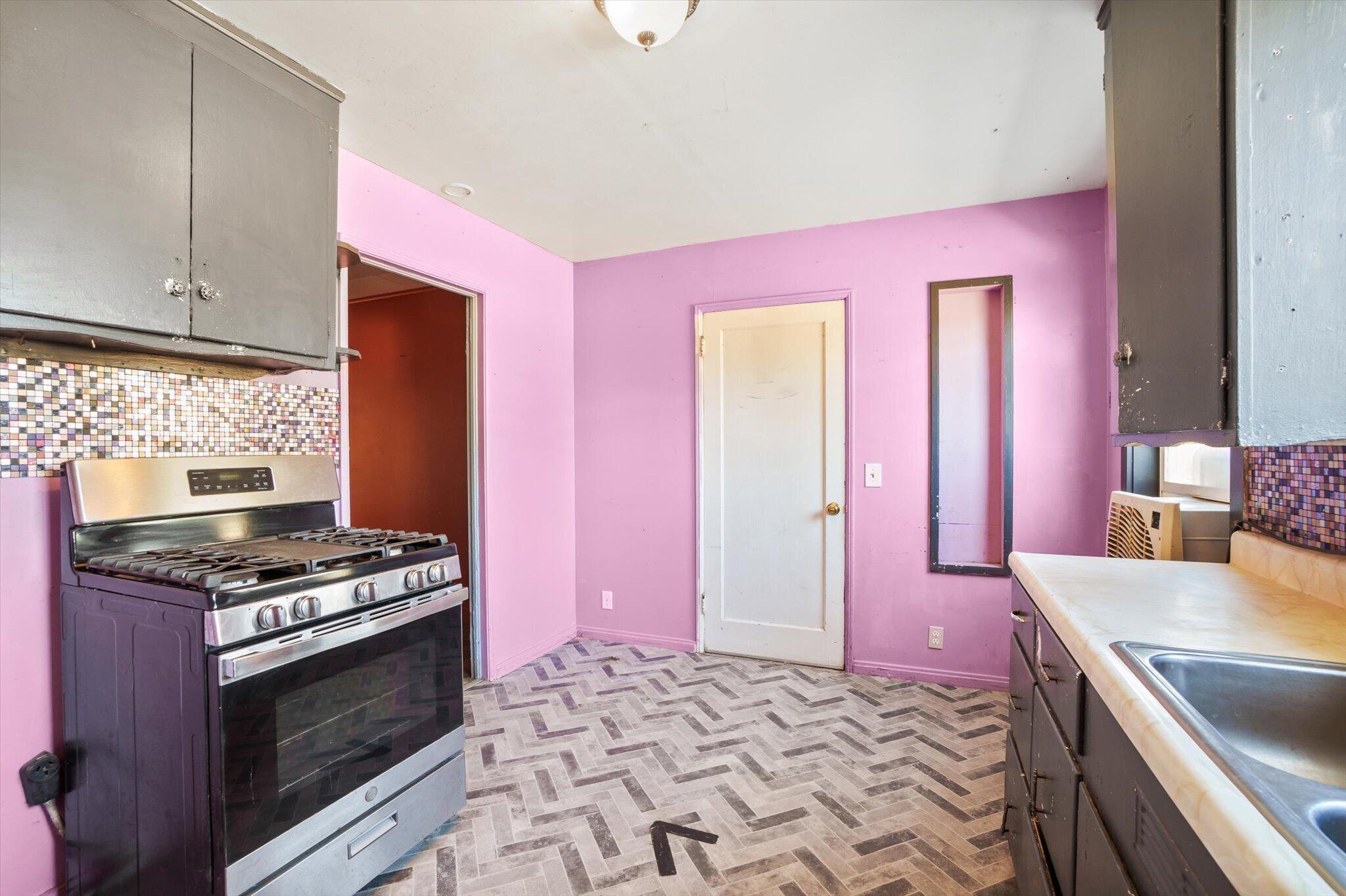 1450 Bulkeley Street Red Bluff, CA 96080 - Photo 7 of 21 a kitchen with stainless steel appliances a sink and a stove