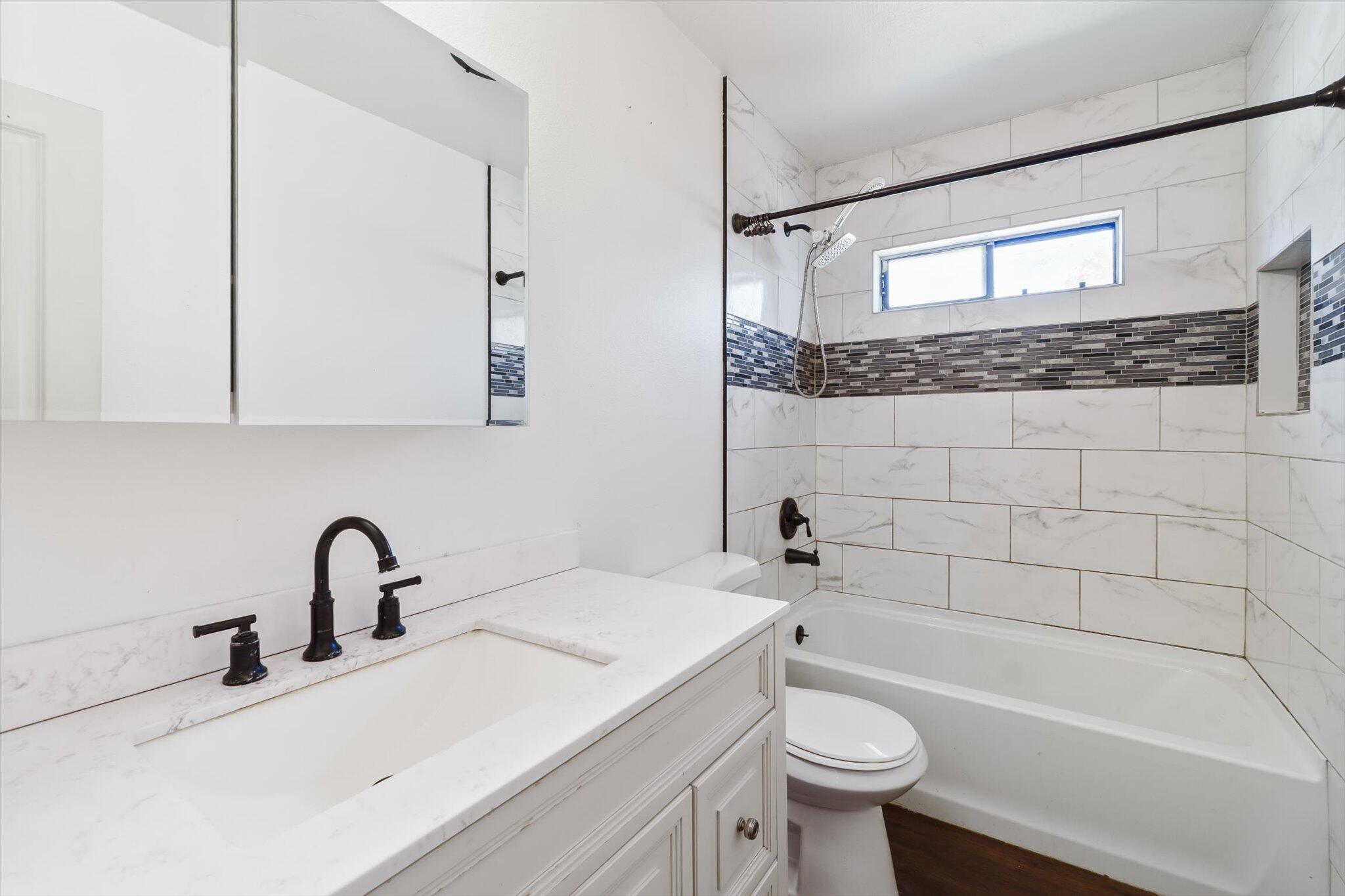 1450 Bulkeley Street Red Bluff, CA 96080 - Photo 10 of 21 a bathroom with a sink a toilet and a bathtub