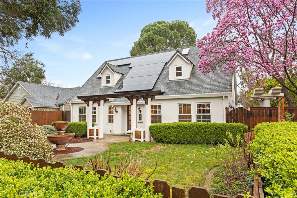 a front view of a house with garden