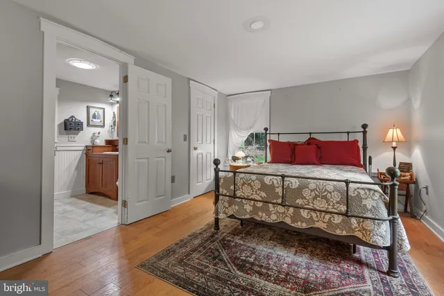 a bed room with a bed and a dresser