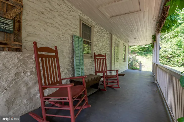 a view of a patio with table and chairs