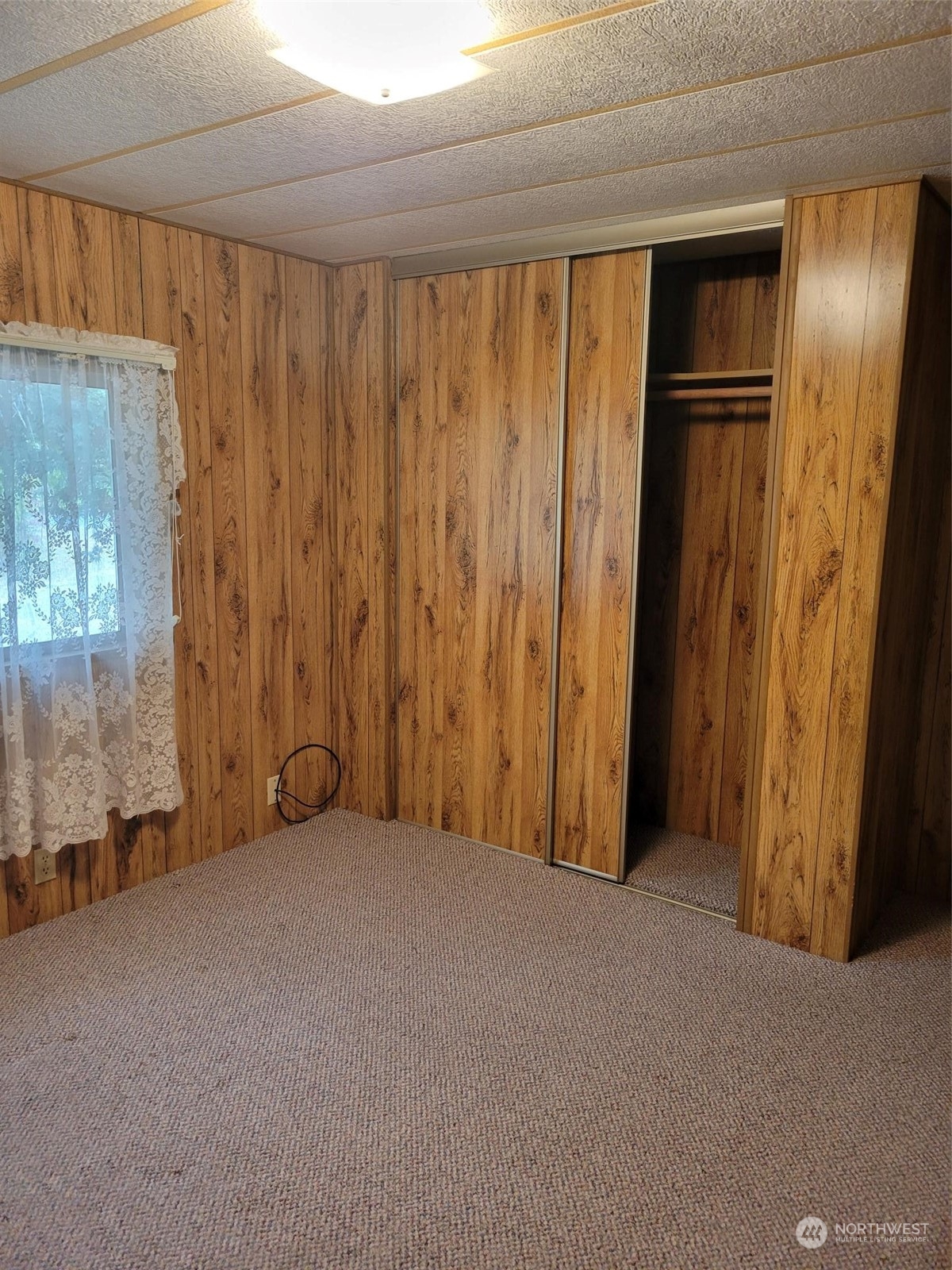 119-13 Peterson Road, Unit 13 Chehalis, WA 98532 - Photo 12 of 31 a view of an empty room with a window