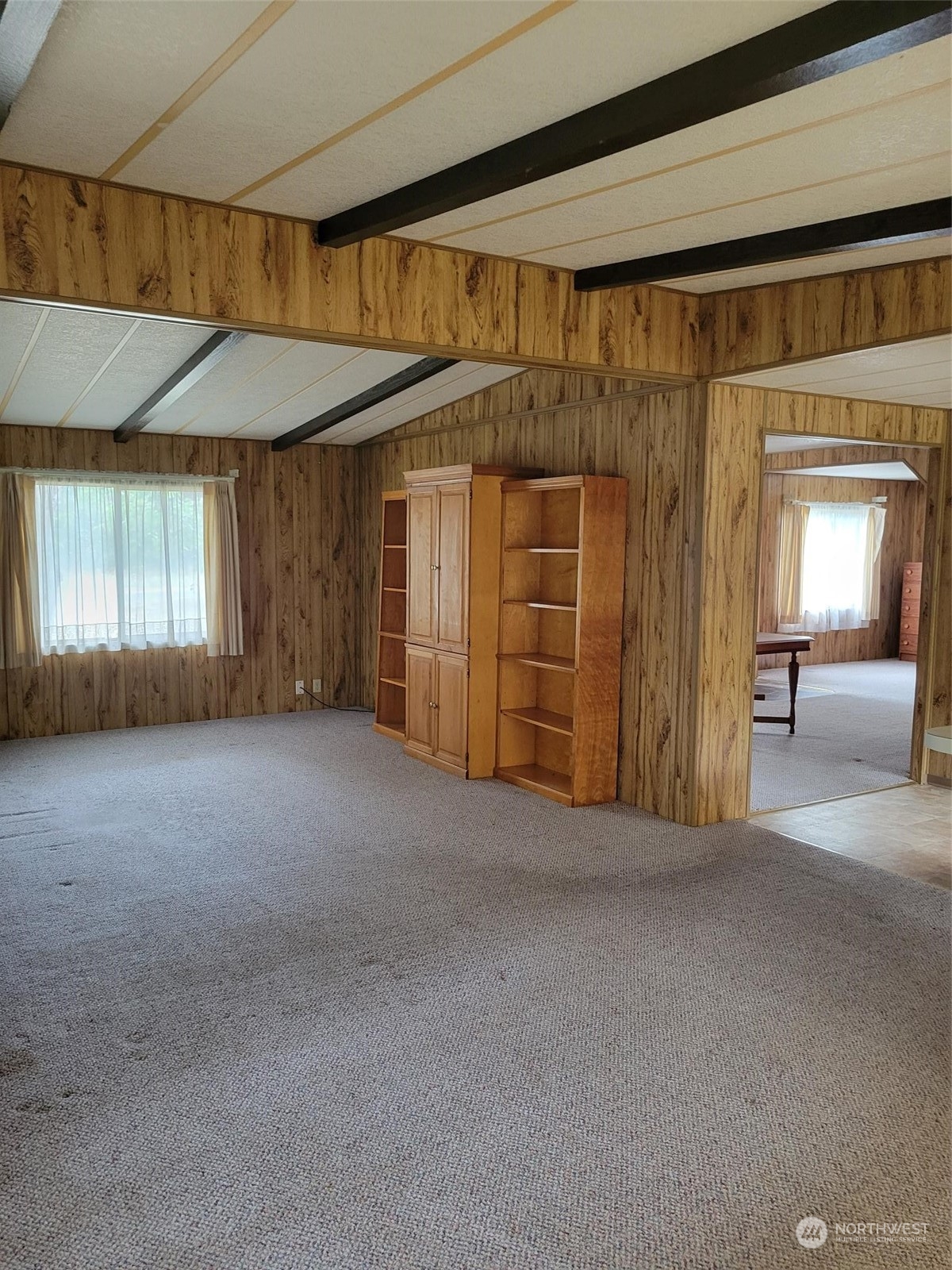 119-13 Peterson Road, Unit 13 Chehalis, WA 98532 - Photo 21 of 31 a view of a room with wooden walls and windows