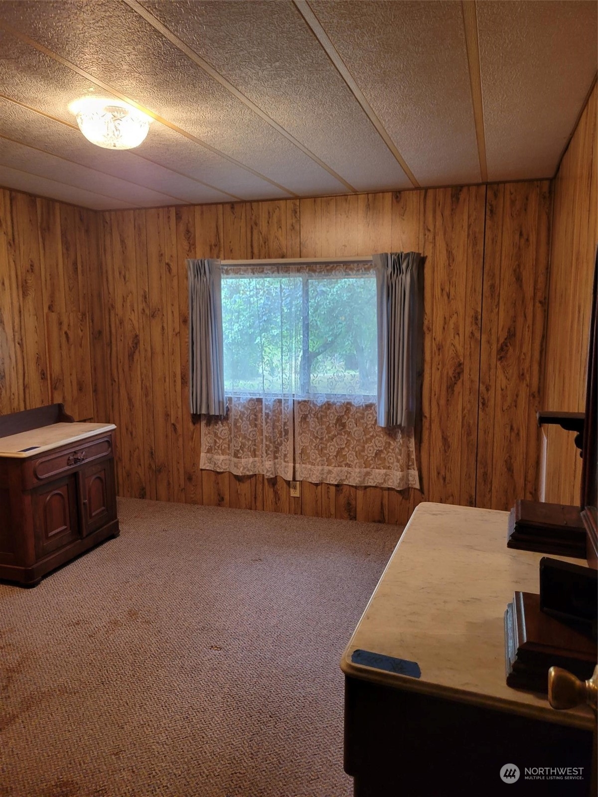119-13 Peterson Road, Unit 13 Chehalis, WA 98532 - Photo 10 of 31 a bed room with a bed and a window