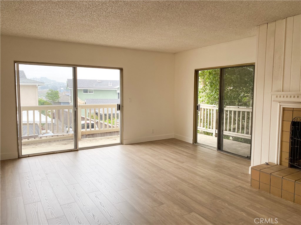 34072 Mazo Drive Dana Point, CA 92629 - Photo 12 of 73 a view of an empty room with wooden floor and a window