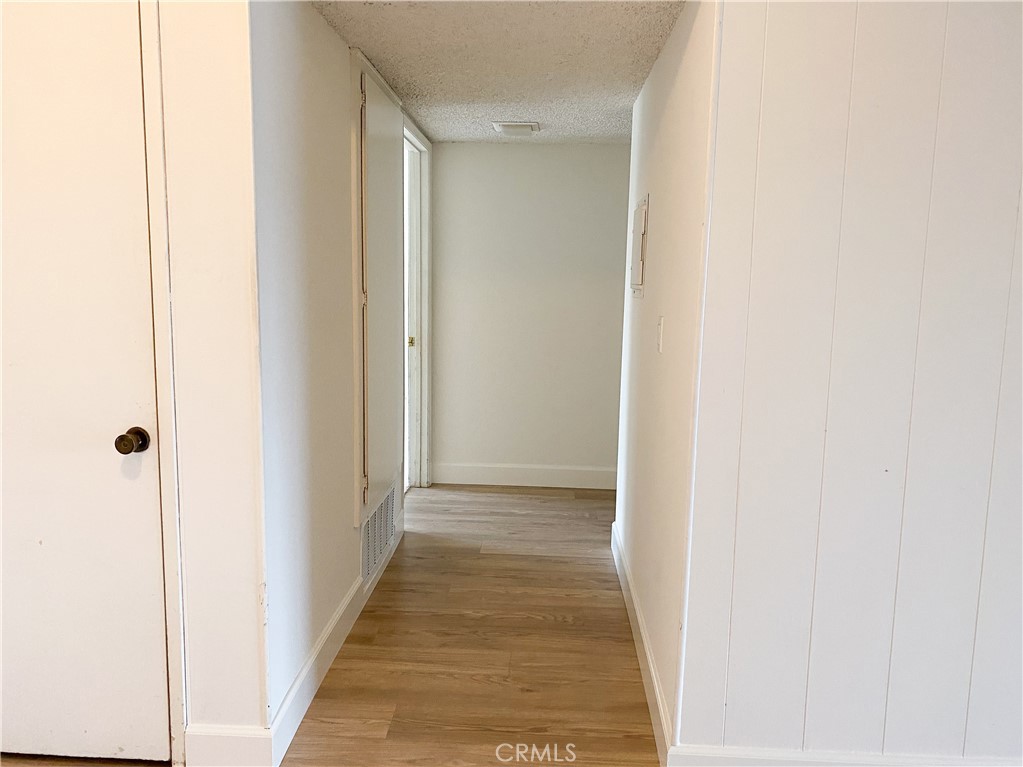34072 Mazo Drive Dana Point, CA 92629 - Photo 20 of 73 a view of a hallway with wooden floor