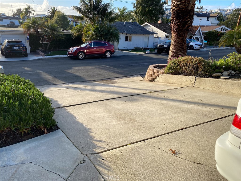 34072 Mazo Drive Dana Point, CA 92629 - Photo 2 of 73 Front of duplex looking back towards street, showing extra long driveway