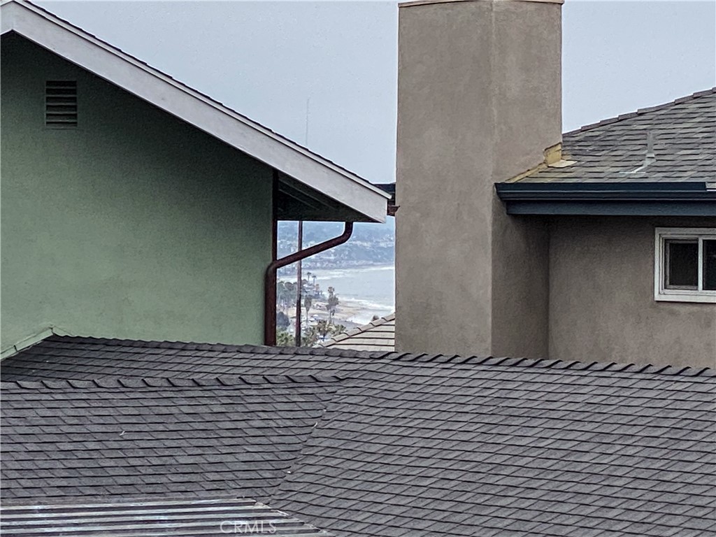 34072 Mazo Drive Dana Point, CA 92629 - Photo 37 of 73 Zoomed in, peek-a-boo white water ocean view from upper unit's master bedroom