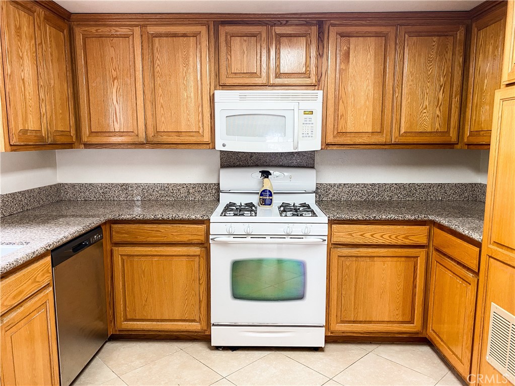34072 Mazo Drive Dana Point, CA 92629 - Photo 53 of 73 a kitchen with granite countertop cabinets stainless steel appliances and sink