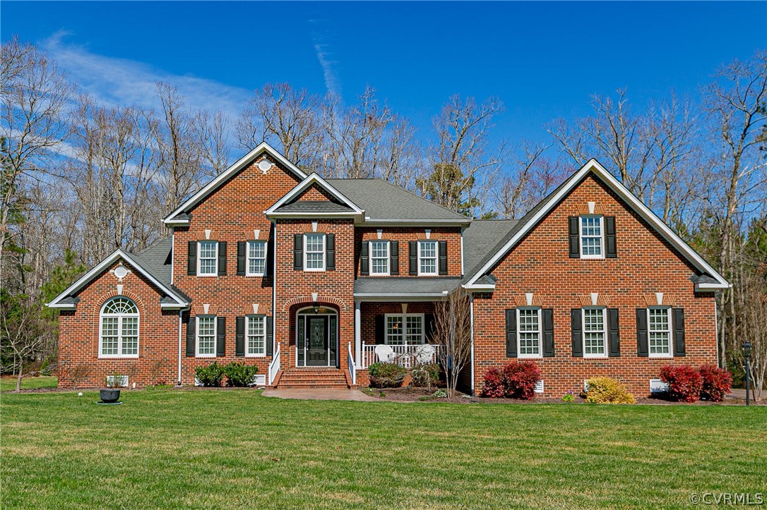 10180 Scots Landing Road Mechanicsville, VA 23116 - Photo 1 of 50 a front view of a house with a yard