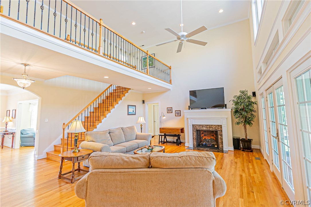 10180 Scots Landing Road Mechanicsville, VA 23116 - Photo 15 of 50 a living room with furniture a fireplace and a flat screen tv