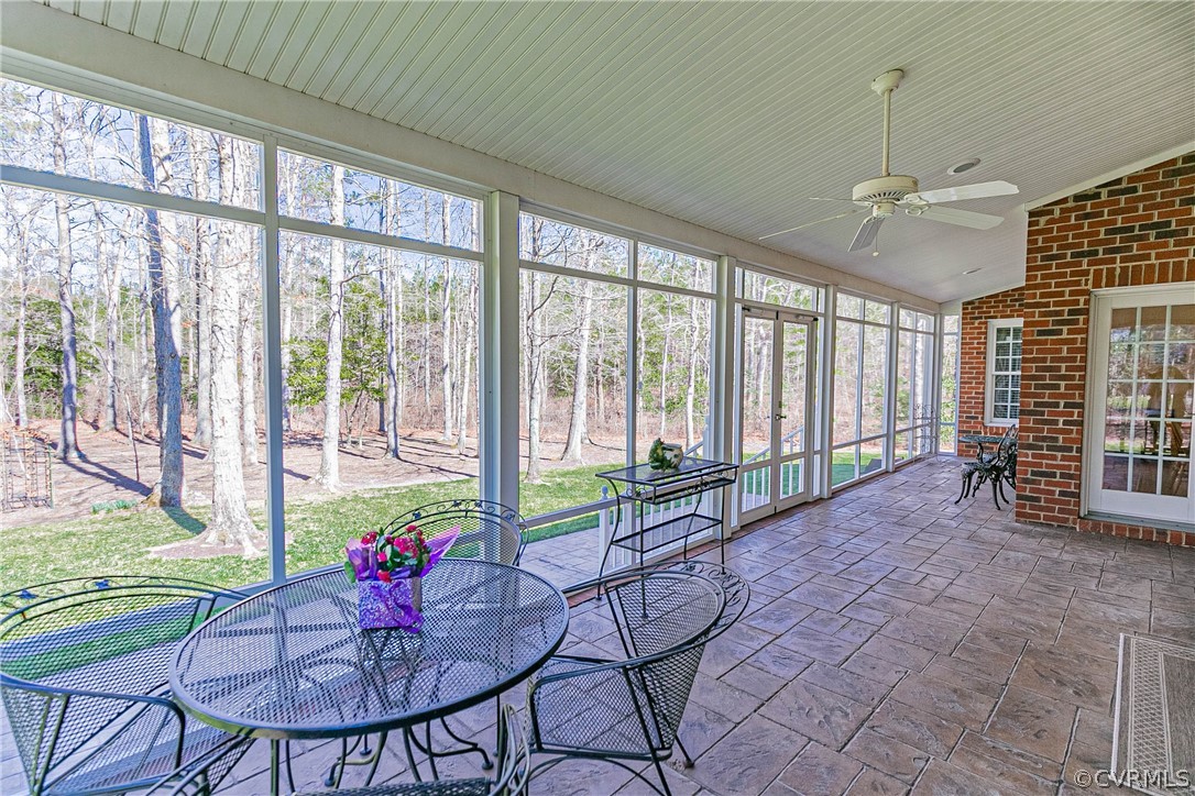 10180 Scots Landing Road Mechanicsville, VA 23116 - Photo 17 of 50 a living room with furniture and floor to ceiling windows