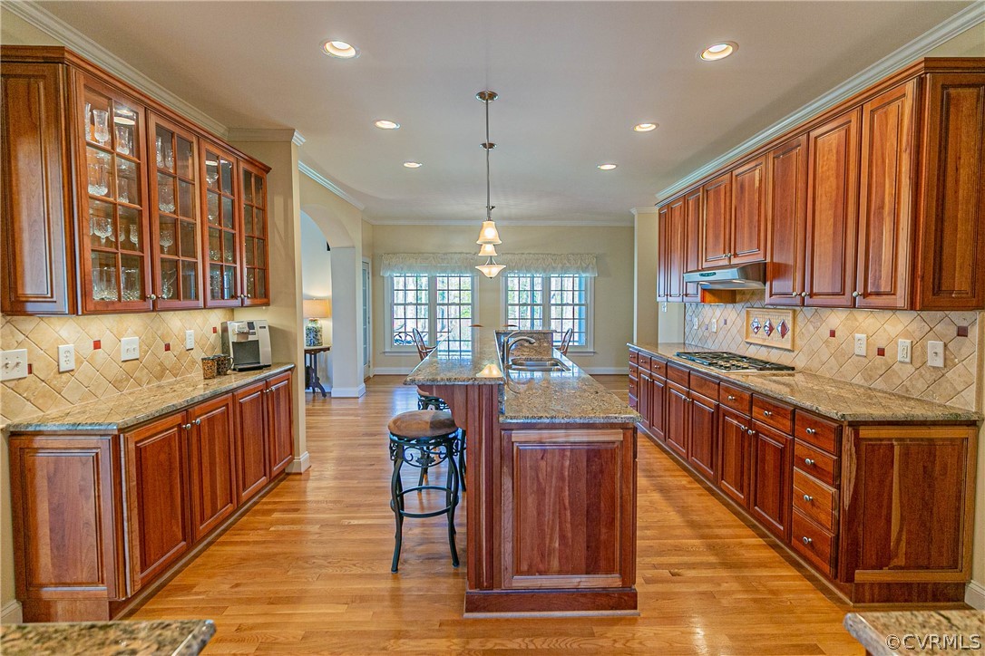 10180 Scots Landing Road Mechanicsville, VA 23116 - Photo 20 of 50 a kitchen with granite countertop a sink and a wooden cabinets