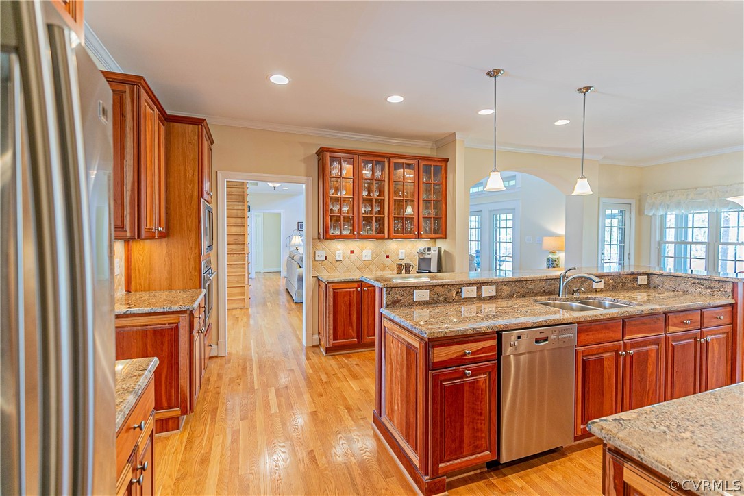 10180 Scots Landing Road Mechanicsville, VA 23116 - Photo 24 of 50 a kitchen with stainless steel appliances granite countertop a stove a sink dishwasher and a refrigerator with wooden floor