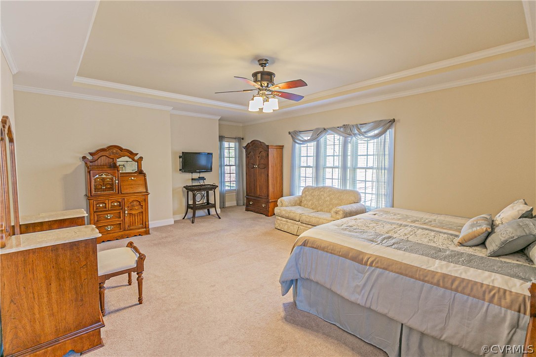 10180 Scots Landing Road Mechanicsville, VA 23116 - Photo 28 of 50 a bedroom with a bed a chandelier and dresser