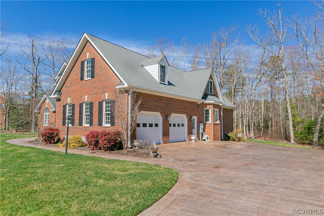 10180 Scots Landing Road Mechanicsville, VA 23116 - Photo 3 of 50 a front view of a house with a yard