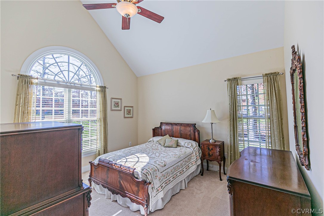 10180 Scots Landing Road Mechanicsville, VA 23116 - Photo 34 of 50 a bedroom with a bed window and a chandelier