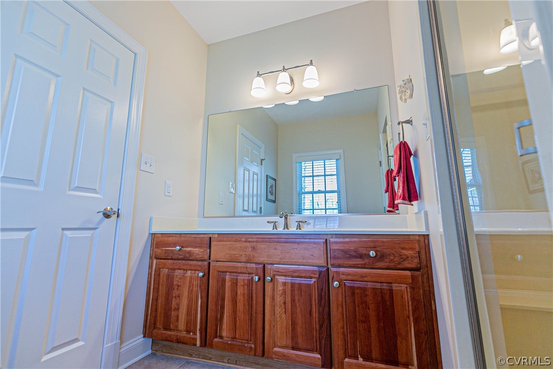 10180 Scots Landing Road Mechanicsville, VA 23116 - Photo 35 of 50 a bathroom with a sink and a mirror