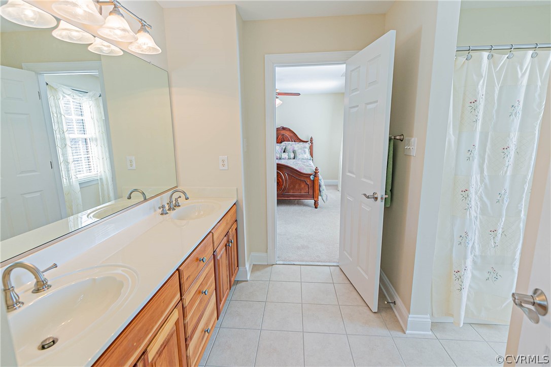 10180 Scots Landing Road Mechanicsville, VA 23116 - Photo 39 of 50 a bathroom with a tub sink and mirror