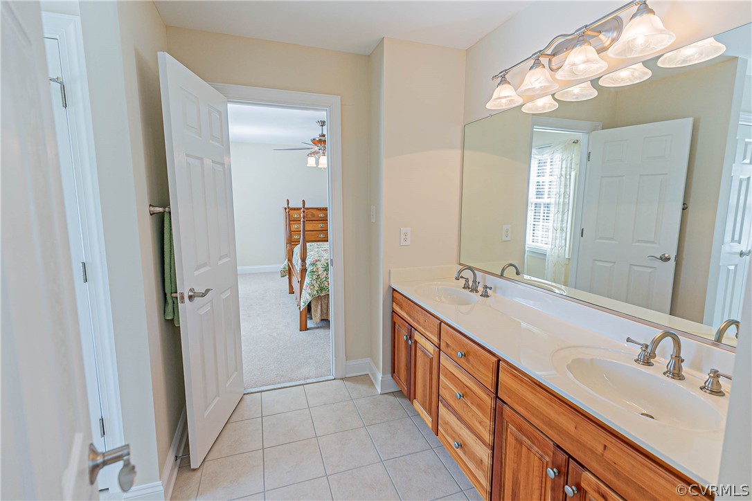 10180 Scots Landing Road Mechanicsville, VA 23116 - Photo 40 of 50 a bathroom with a double vanity sink and a mirror