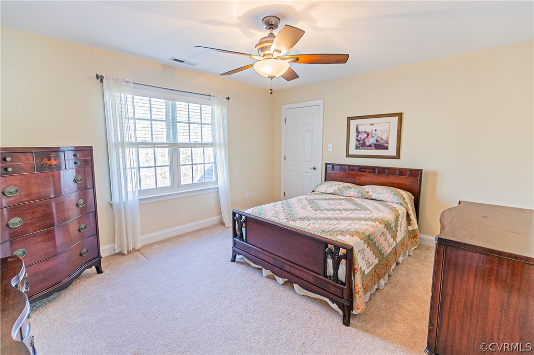 10180 Scots Landing Road Mechanicsville, VA 23116 - Photo 43 of 50 a bedroom with a bed dresser and a window
