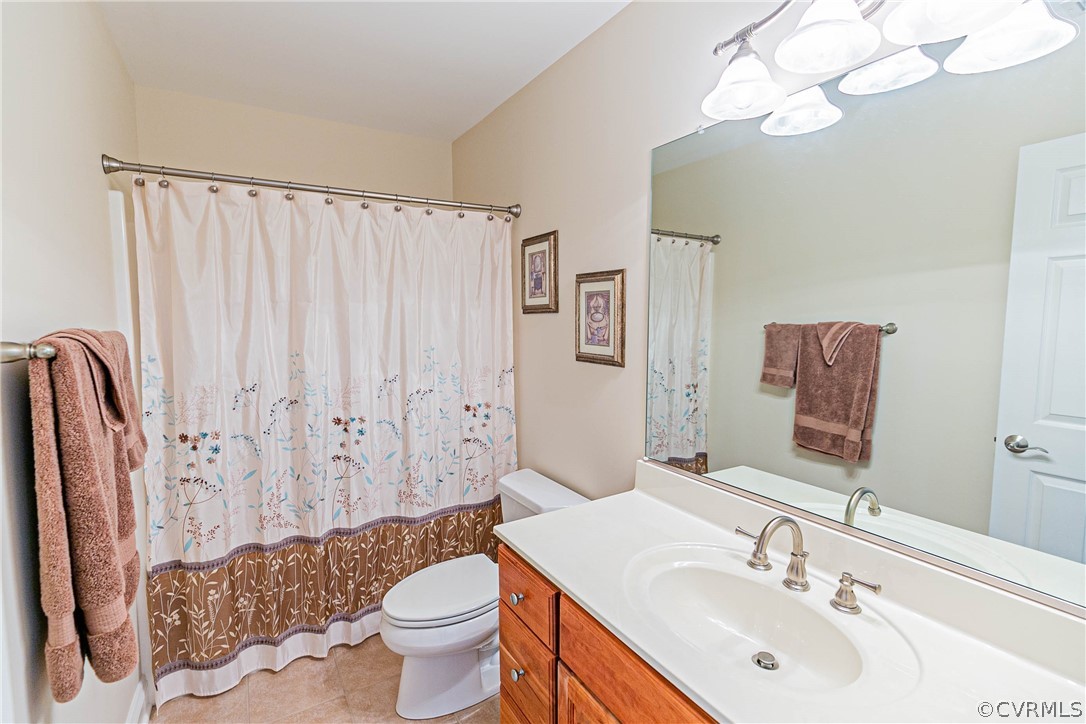 10180 Scots Landing Road Mechanicsville, VA 23116 - Photo 44 of 50 a bathroom with a sink vanity mirror and toilet