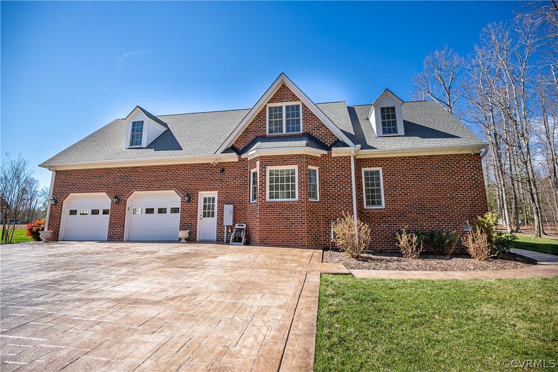 10180 Scots Landing Road Mechanicsville, VA 23116 - Photo 48 of 50 a front view of a house with a yard