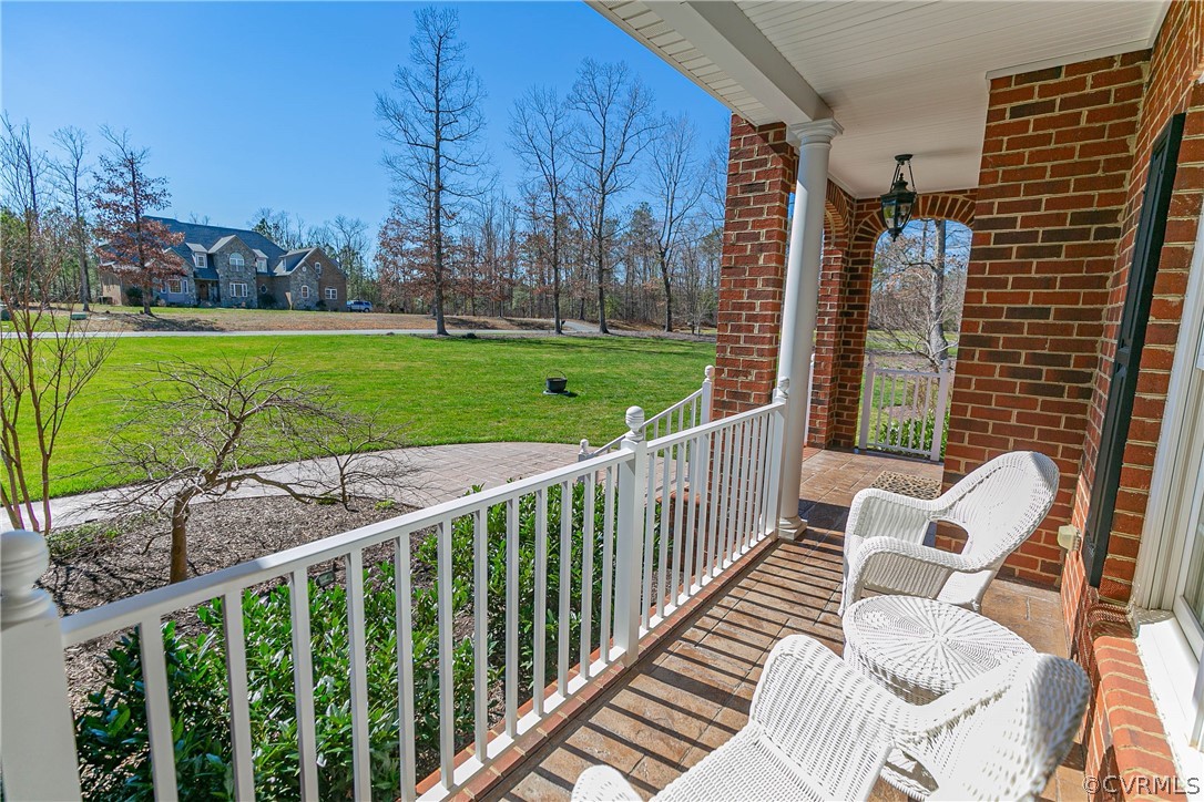 10180 Scots Landing Road Mechanicsville, VA 23116 - Photo 5 of 50 a view of a porch with a yard