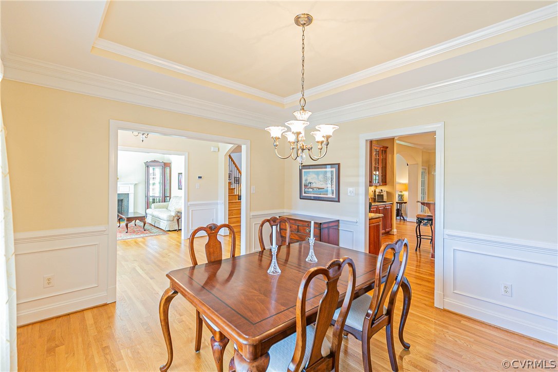 10180 Scots Landing Road Mechanicsville, VA 23116 - Photo 7 of 50 a view of a dining room with furniture and chandelier