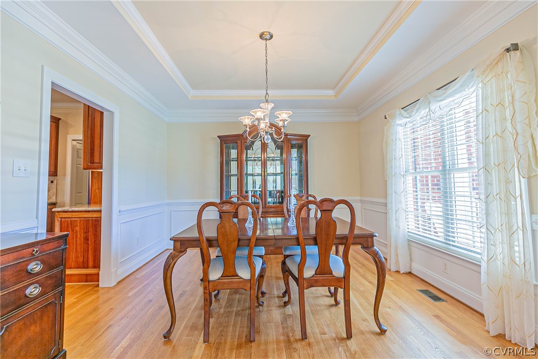 10180 Scots Landing Road Mechanicsville, VA 23116 - Photo 8 of 50 a view of a dining room with furniture window and wooden floor