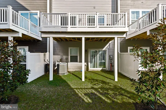 a view of a house with many windows and a table