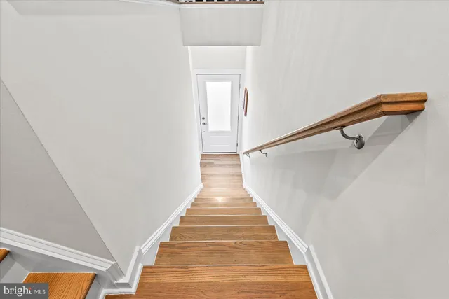 a open kitchen with stainless steel appliances granite countertop a lot of counter space and wooden floors