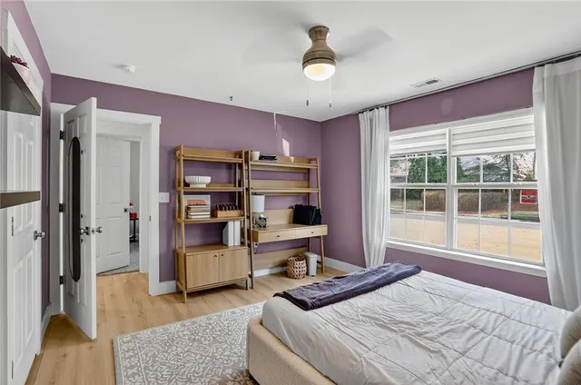 a bedroom with furniture and window