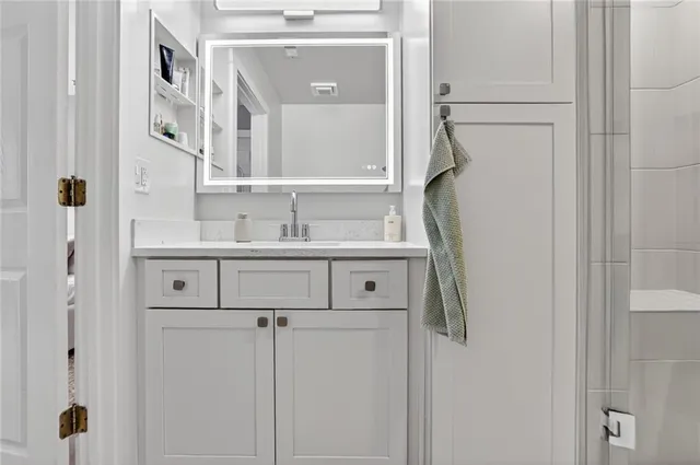 a bathroom with a sink and a mirror